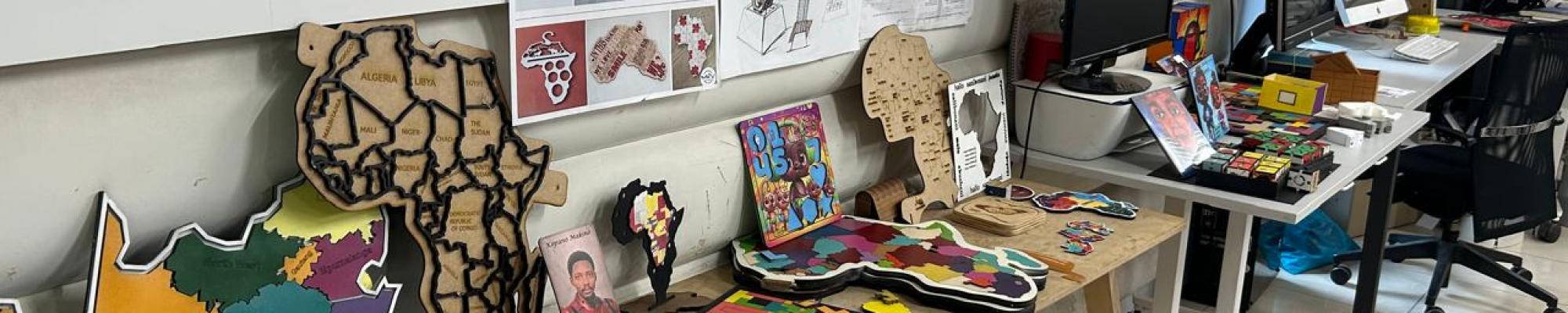 puzzles and different and othedr handmade products laid out on table